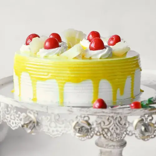 https://shoppingyatra.com/product_images/Pineapple Cake with Cherry Toppings (Half Kg)2.webp